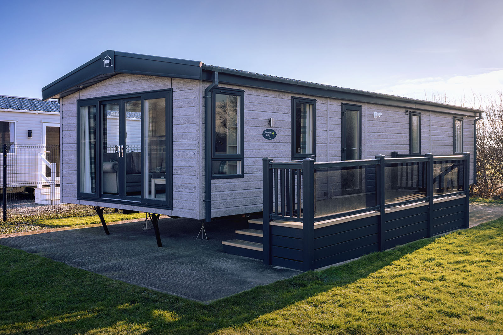 TCS Hamilton Lodge caravan situated in a holiday park.